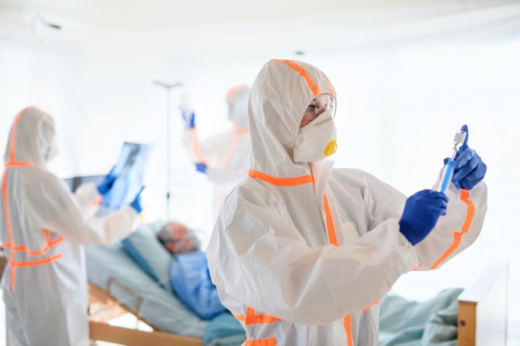 Doctor with vaccine in hospital, coronavirus concept